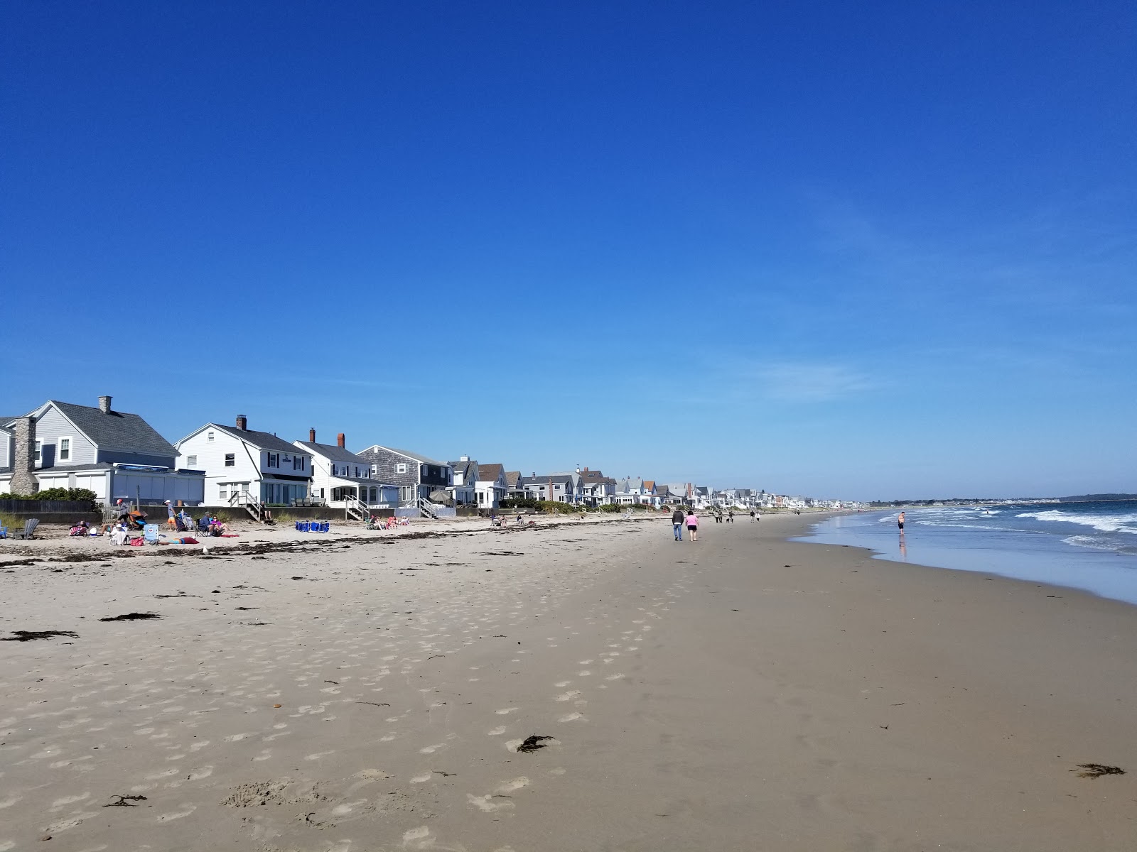 Photo de Wells beach avec sable lumineux de surface