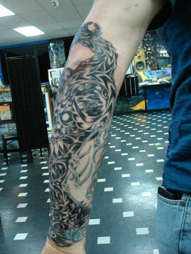 Explore half sleeve tattoo design ideas, creative tattoo ideas in Bowling Green, available at Taboo Tattoos and Piercings