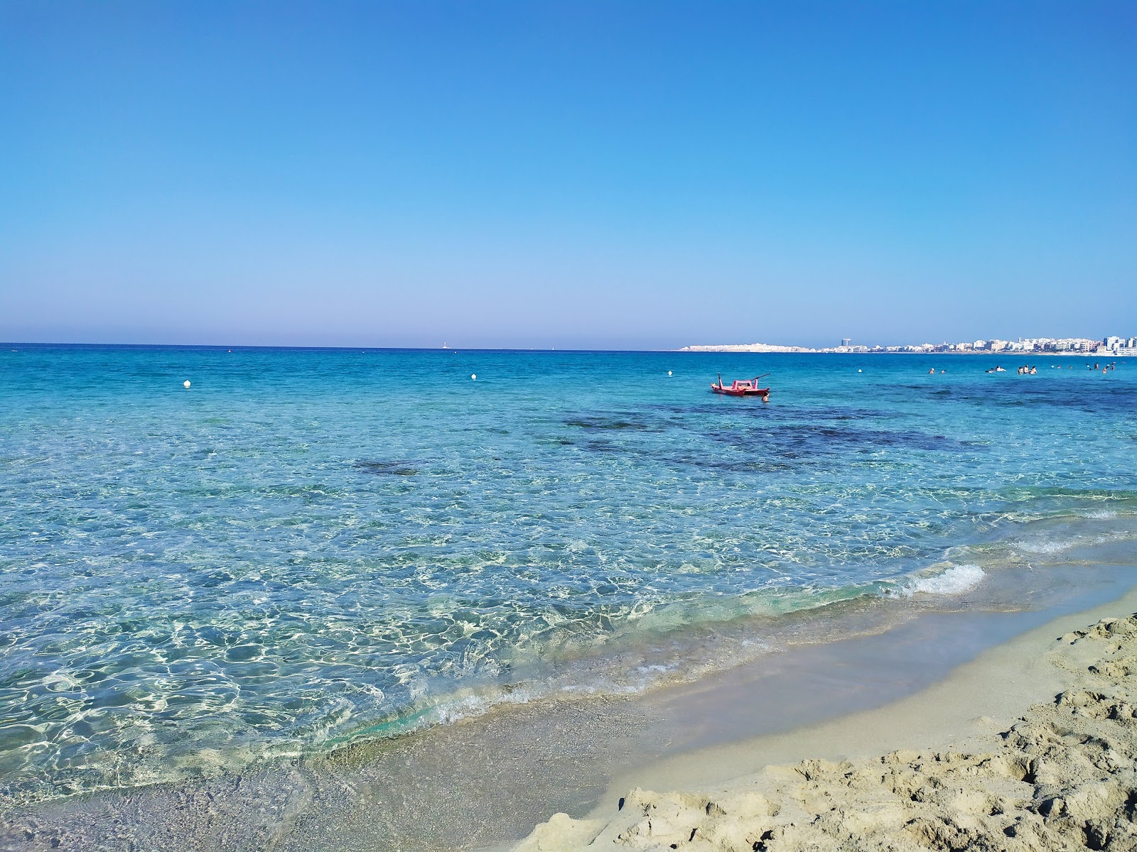 Photo de Spiaggia di Baia Verde - recommandé pour les voyageurs en famille avec des enfants