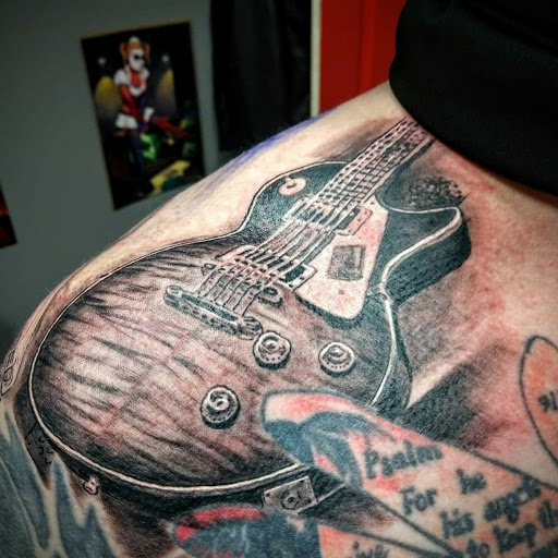 Explore rose hand tattoo ideas, creative tattoo ideas in Mooresville, available at Anythings Possible