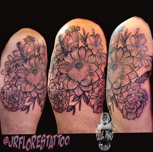 Explore never give up tattoo ideas, creative tattoo ideas in Caldwell, available at Blue Ring Studio Tattoo & Piercing