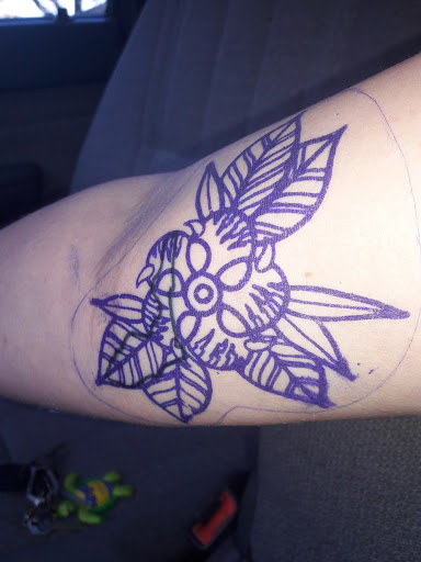 Explore women's thigh tattoo ideas, creative tattoo ideas in Lakeland, available at Black Swan Tattoo