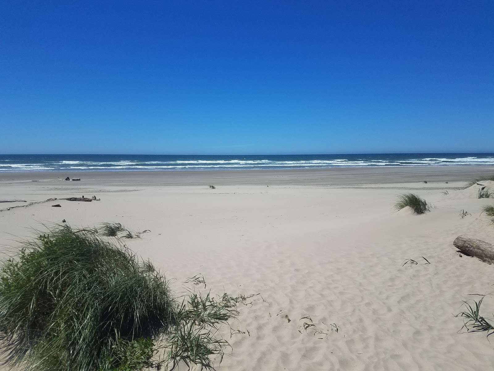 Foto von Bayshore beach mit heller sand Oberfläche