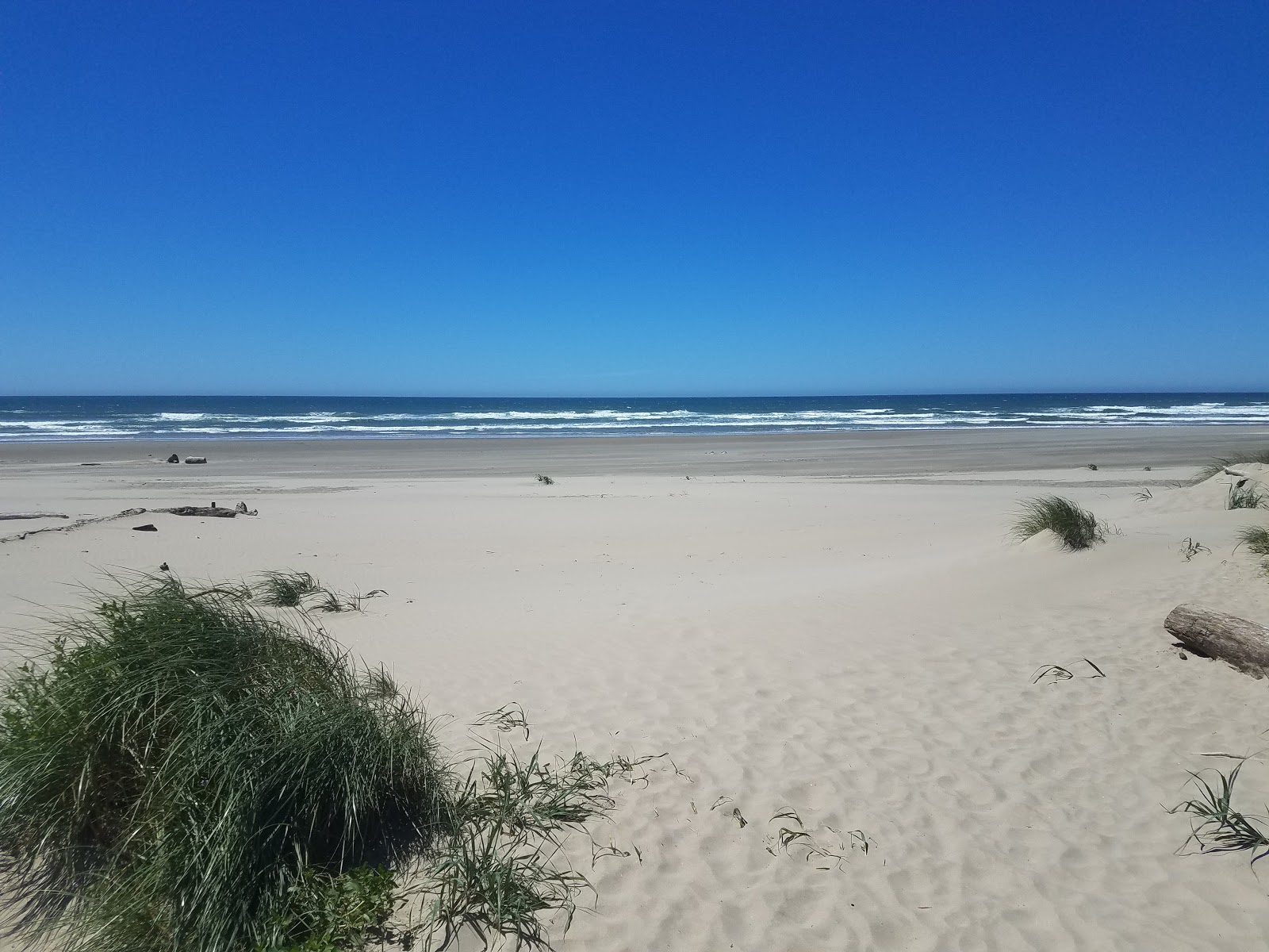 Foto von Bayshore beach mit beiger sand Oberfläche
