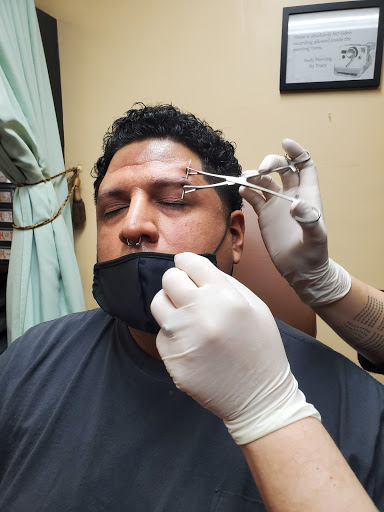 Find in between boob tattoo ideas for your next unique tattoo in Oceanside at Body Piercing By Tracy