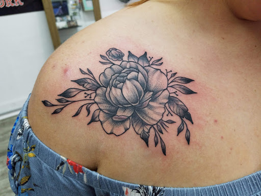 Explore dog bone tattoo ideas, creative tattoo ideas in Medina, available at Canalside Tattoo Company