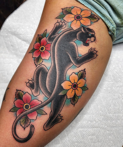 Explore cover up tattoo ideas female leg, creative tattoo ideas in West Jefferson, available at Black Dagger Tattoo Collective