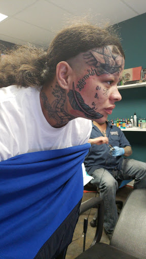 Explore knee cap tattoo ideas for men, creative tattoo ideas in Omaha, available at A New Creation Tattoo