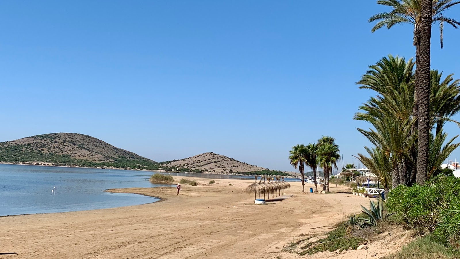 Foto von Playa de Puerto Bello mit brauner sand Oberfläche