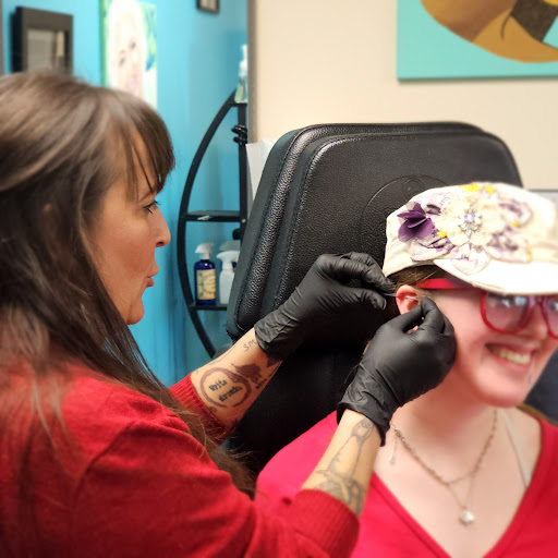 Explore wedding ring tattoo ideas for men, creative tattoo ideas in Traverse City, available at Pinups & Needles