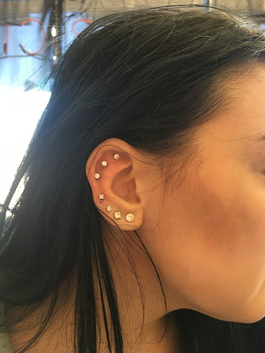 Explore back of the ear tattoo ideas, creative tattoo ideas in Farmington, available at TATTOO 13 & Laser Tattoo Removal