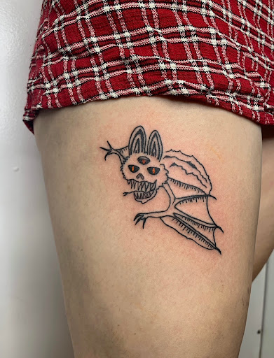 Explore spine tattoo cover up ideas, creative tattoo ideas in Milwaukee, available at The Skin Museum