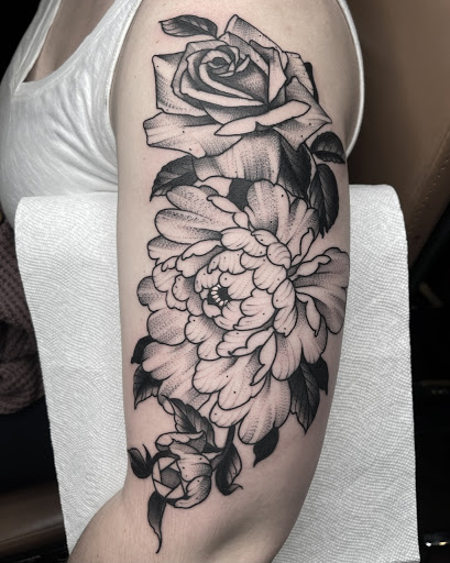 Explore horseshoe tattoo ideas, creative tattoo ideas in Johnson City, available at Gold Cross Tattoo Co.