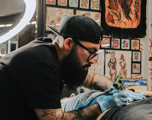 Find female rib tattoo ideas for your next unique tattoo in Lakewood at Aces and Eights Tattoo