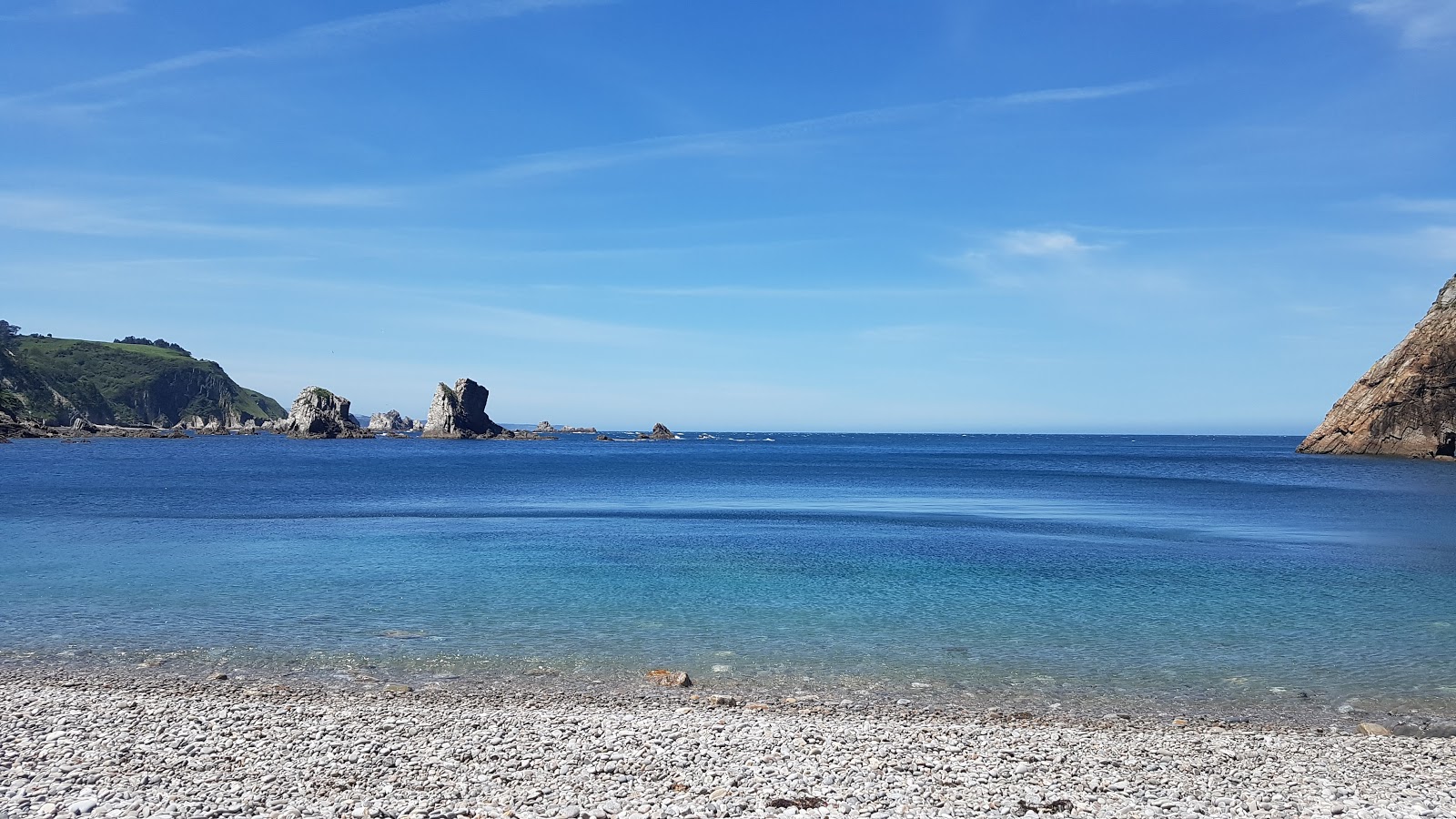 Foto di Playa del Silencio con una superficie del acqua cristallina