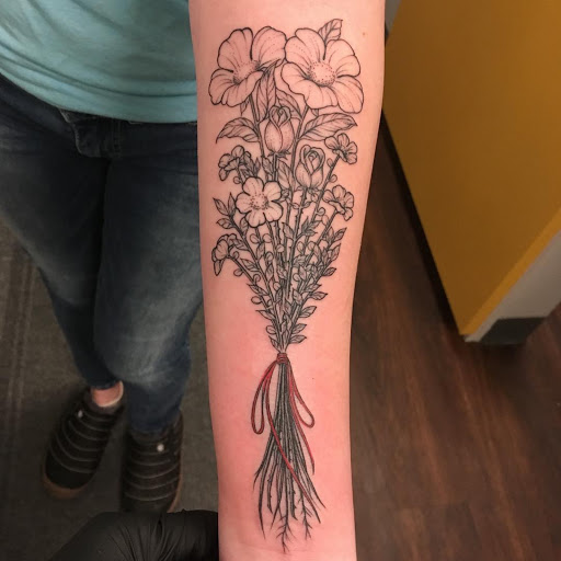 Explore wrist name tattoo ideas, creative tattoo ideas in Montpelier, available at Marigold Adornment Tattoo, Piercing, & Jewelry.