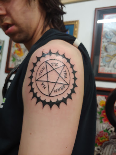 Explore moon tattoo ideas for guys, creative tattoo ideas in Asheville, available at Diamond Thieves Body Piercing and Tattoo