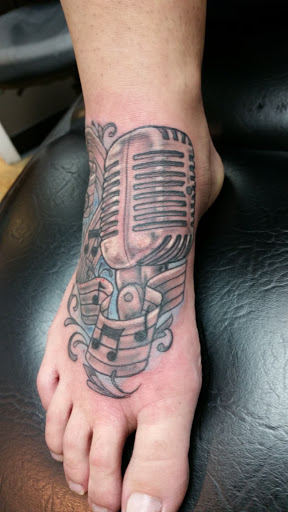 Explore enlightenment tattoo ideas, creative tattoo ideas in Knoxville, available at Mythical Markings Tattoo Studio