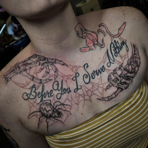 Find flower thigh tattoo ideas for your next unique tattoo in Palm Harbor at Angry Owl Tattoo and Piercing