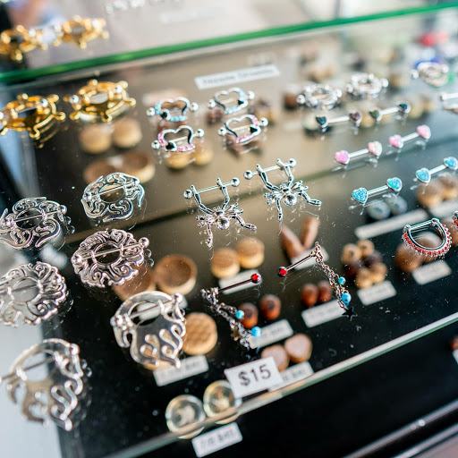 Explore men back tattoo ideas, creative tattoo ideas in Summerville, available at Exotic Impressions Body Piercing