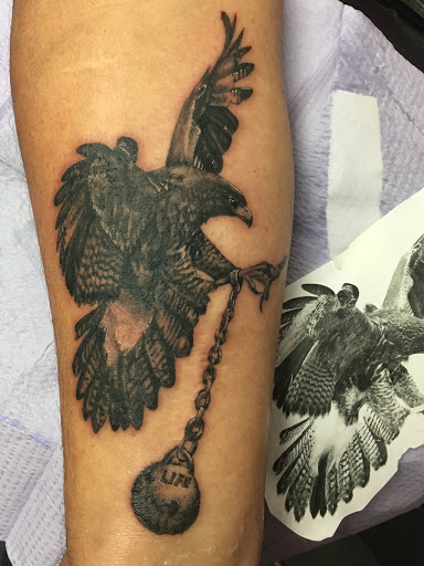 Explore cover up tattoo ideas for leg, creative tattoo ideas in Largo, available at Alchemy Tattoos and Body Piercings