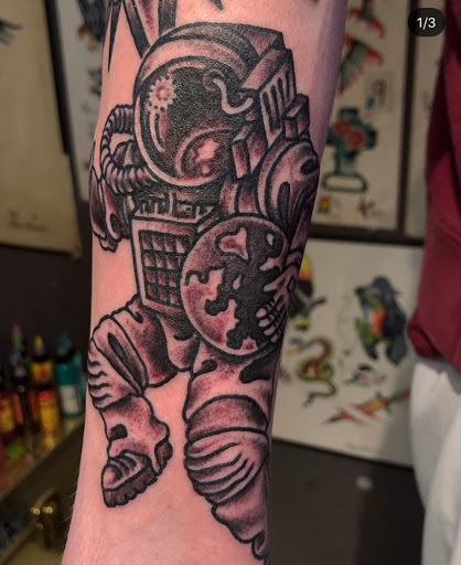 Explore band tattoo ideas, creative tattoo ideas in Kansas City, available at Grimm Tattoo and Bert Grimm Museum