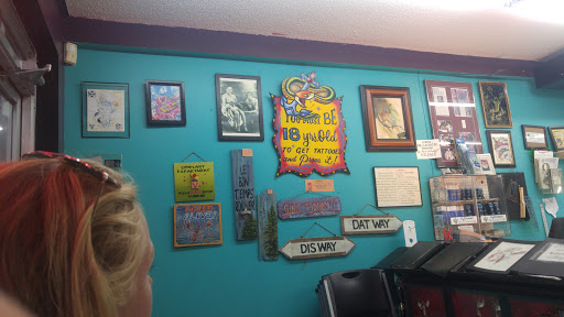 Explore flower tattoo ideas for guys, creative tattoo ideas in Kenner, available at Electric Expressions