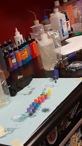 Explore lower leg tattoo ideas, creative tattoo ideas in Powell, available at Against All Odds Tattoos and Piercings