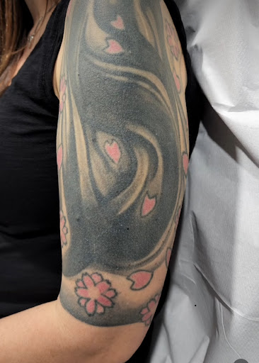 Explore lighthouse tattoo ideas, creative tattoo ideas in Jensen Beach, available at Treasure Coast Tattoo Co.