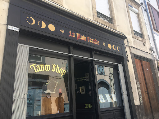 La main occulte *Tattoo Shop*