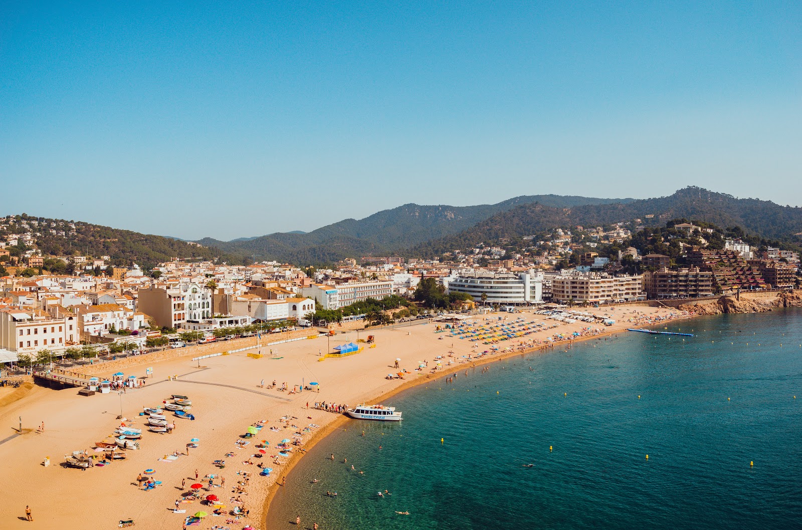Photo of Tossa de Mar Beach with turquoise pure water surface