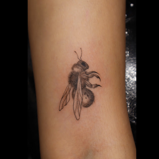 Explore beach tattoo ideas for men, creative tattoo ideas in San Diego, available at Nothing Sacred Tattoo