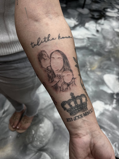 Explore memorial cross tattoo ideas, creative tattoo ideas in Westwood, available at Dom Astro Tattoo Company