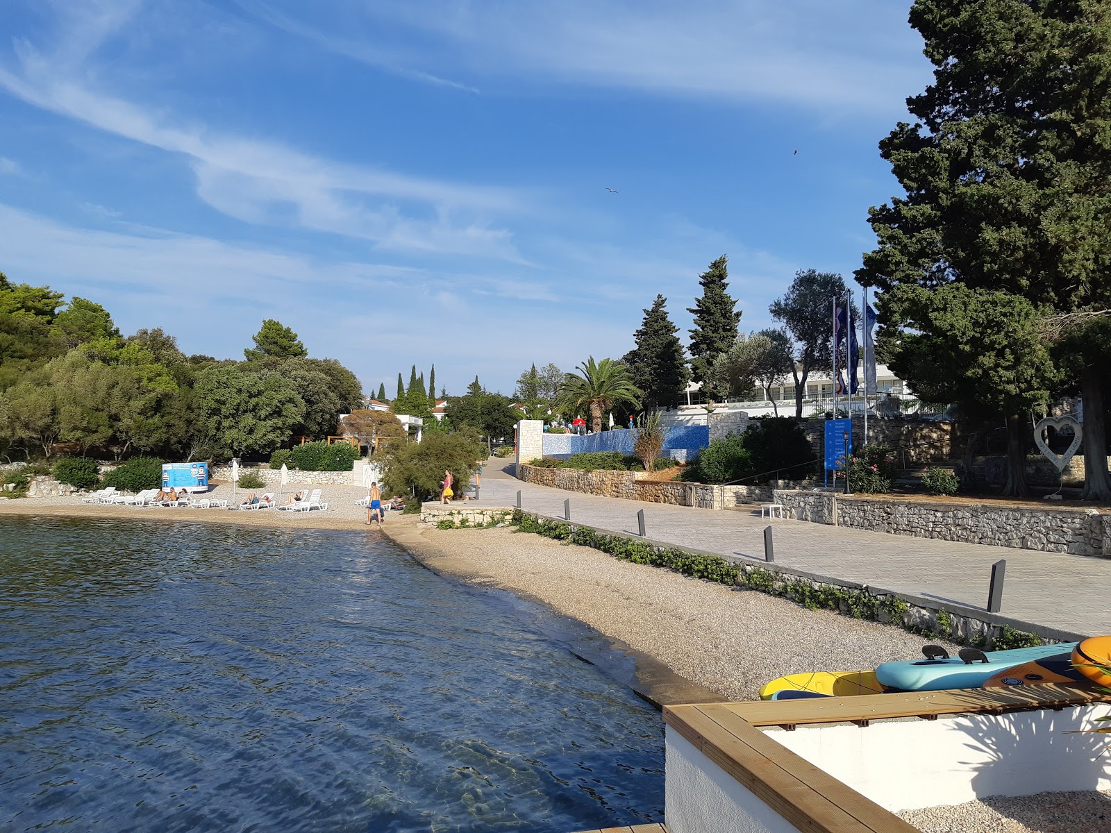 Foto di Punta Kriza beach con una superficie del sabbia beige e ciottoli