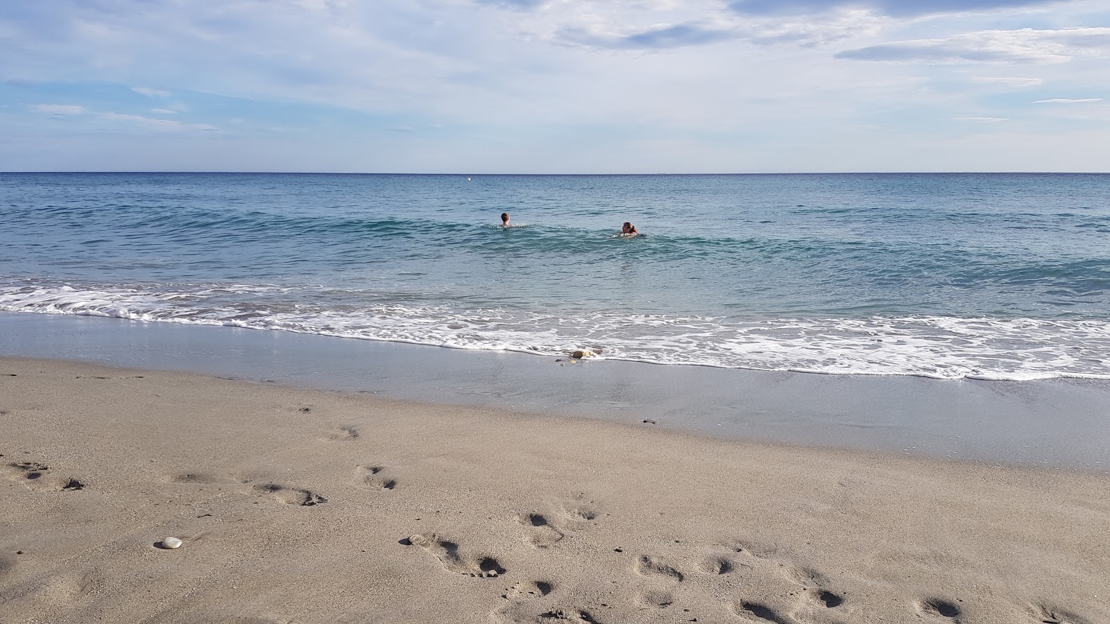 Foto van Playa de la Torrecilla en de nederzetting