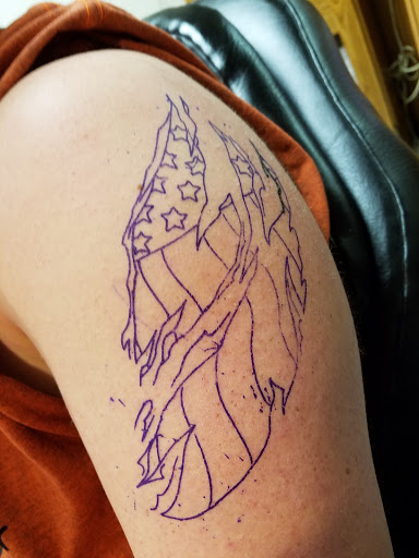 Explore slipknot tattoo ideas, creative tattoo ideas in Johnstown, available at Screaming Needle Tattoo & Body Piercing