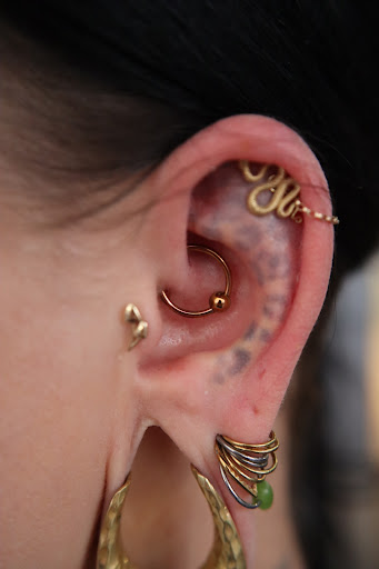 Explore female throat tattoo ideas, creative tattoo ideas in Mobile, available at Old Familiar Tattoo Company