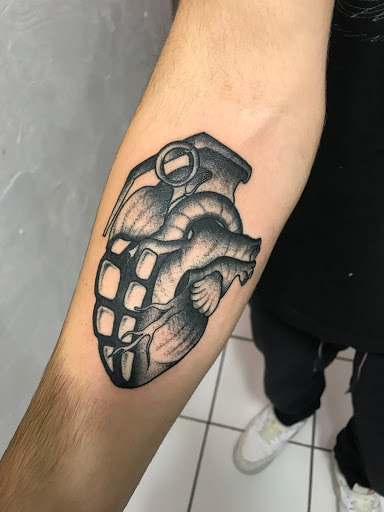 Explore inner bicep tattoo ideas for men, creative tattoo ideas in Springfield, available at Tattoo Royale
