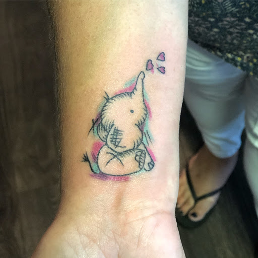 Explore goldendoodle tattoo ideas, creative tattoo ideas in Sanford, available at Hudson & Company Tattoo Studio