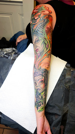 Explore stamp tattoo ideas, creative tattoo ideas in Stuart, available at Tiger Shark Tattoo Studio