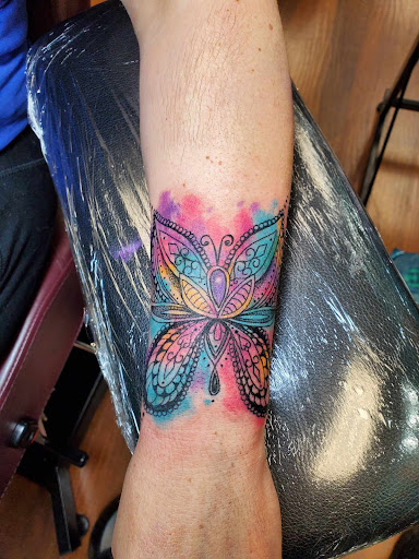 Explore hibiscus flower tattoo ideas, creative tattoo ideas in Independence, available at Odins Mark Tattoo and Emporium