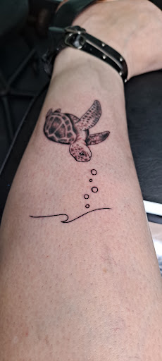 Explore tattoo ideas for side of stomach, creative tattoo ideas in Destin, available at Atomic Frog Tattoo