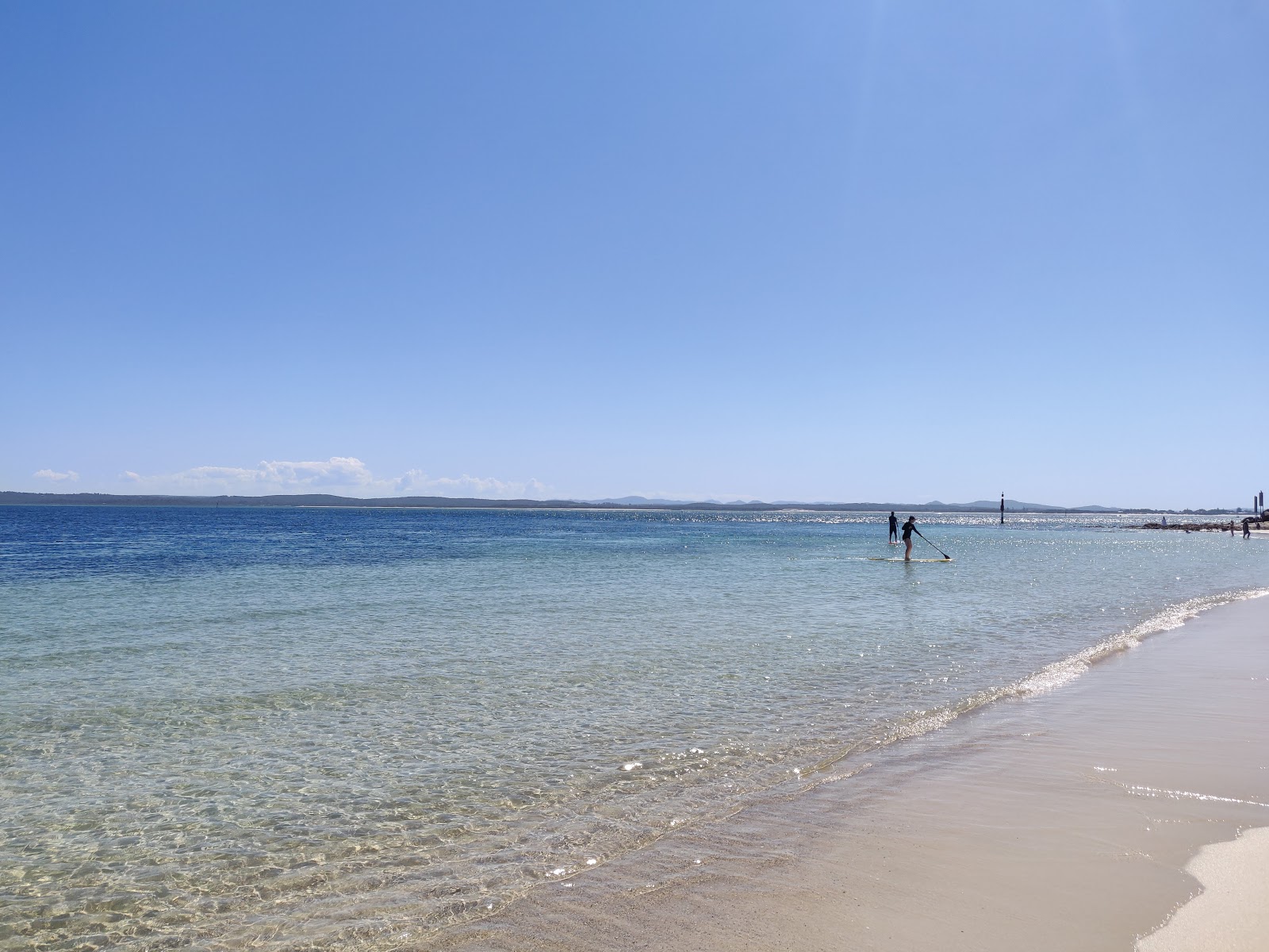 Fotografie cu Nelson Bay Beach cu o suprafață de apa pură turcoaz