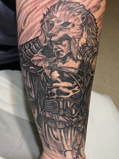 Explore fist tattoo ideas, creative tattoo ideas in Montgomery, available at Black Dragon Tattoo & Gallery