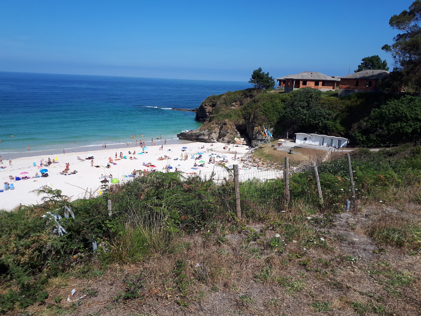 Photo of Playa de Areoura and the settlement