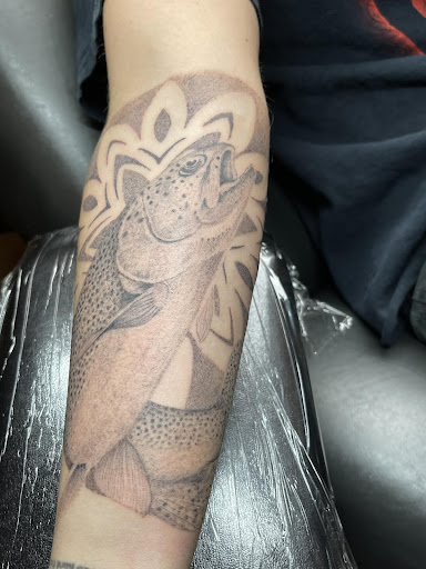 Explore forearm flower tattoo ideas, creative tattoo ideas in Spokane, available at Ron LeMay Tattoo