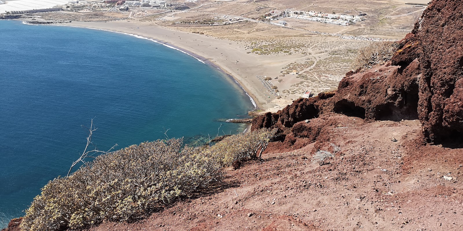 Foto av Playa de la Tejita med grönt vatten yta