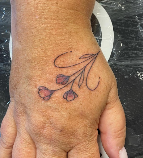 Find mom of 4 tattoo ideas for your next unique tattoo in Woodstock at Lost Lagoon Tattoo