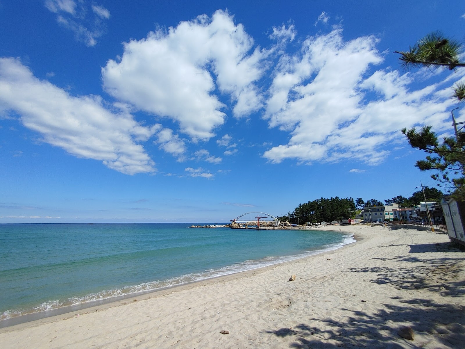 Photo of Yonghwa Beach surrounded by mountains