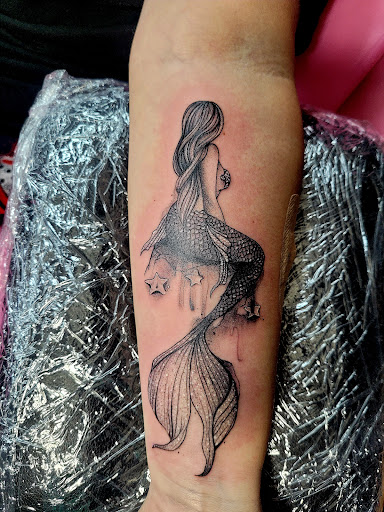 Explore leg tattoo ideas black male, creative tattoo ideas in Benton, available at Spectrum Tattoo